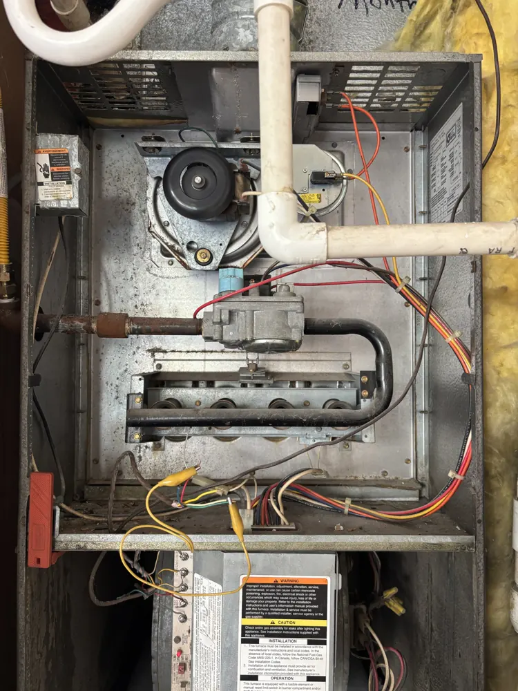 A Citrus Heights gas furnace with the burner compartment open