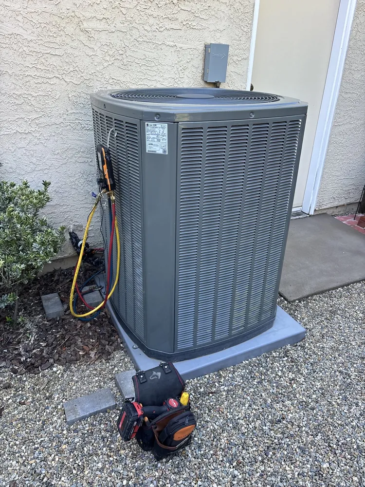 Trane condenser with a digital manifold connected during a Folsom tune-up
