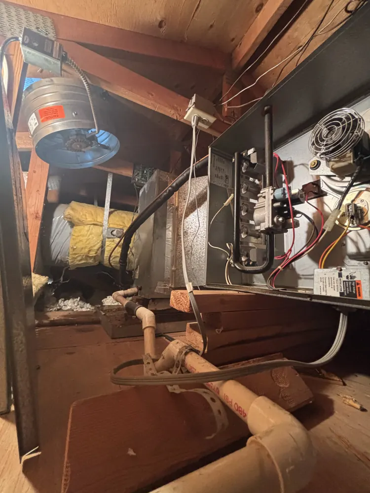 An attic furnace in Folsom with its service panel open