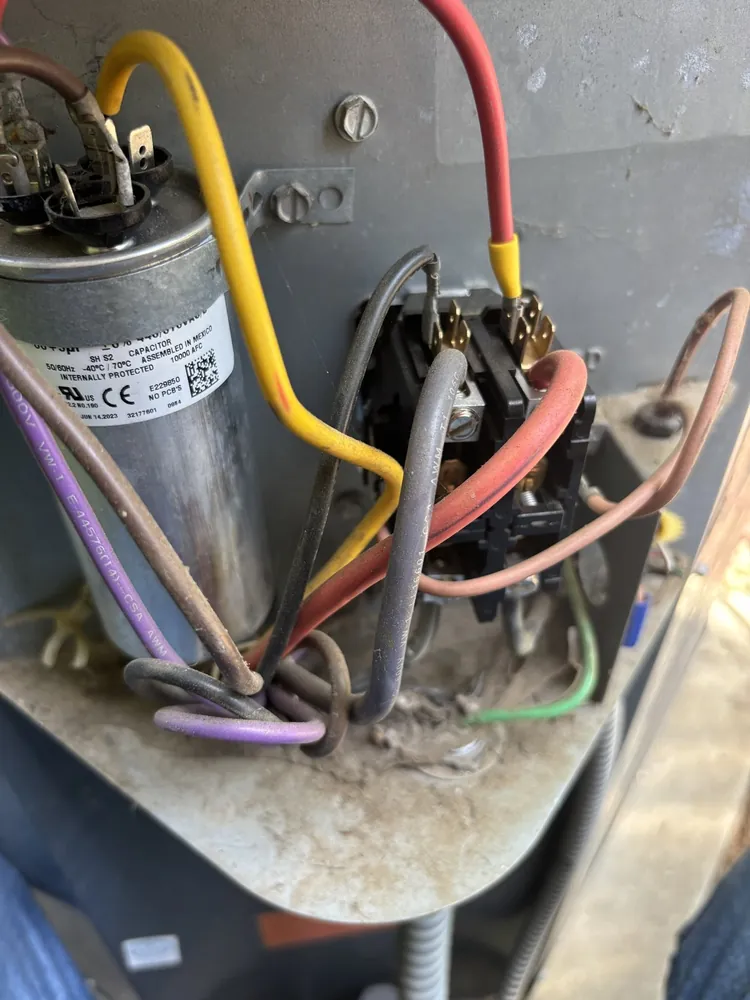 Dual-run capacitor and contactor on a condenser control shelf in Folsom