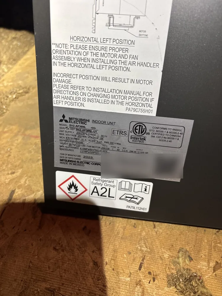Label on a Mitsubishi air handler in a Folsom attic