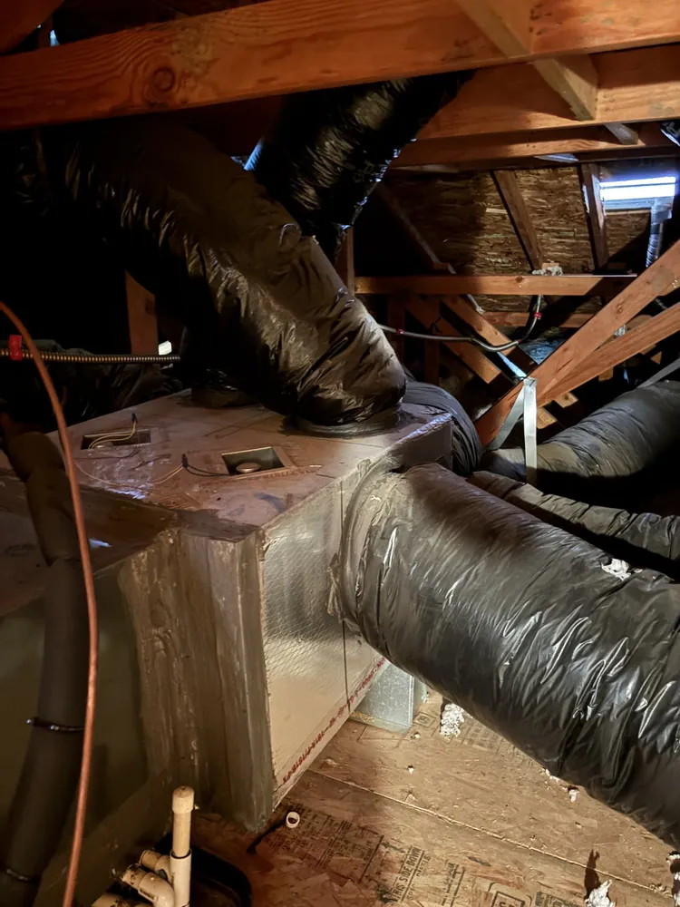 Supply plenum with insulated flex duct branches in a Folsom attic