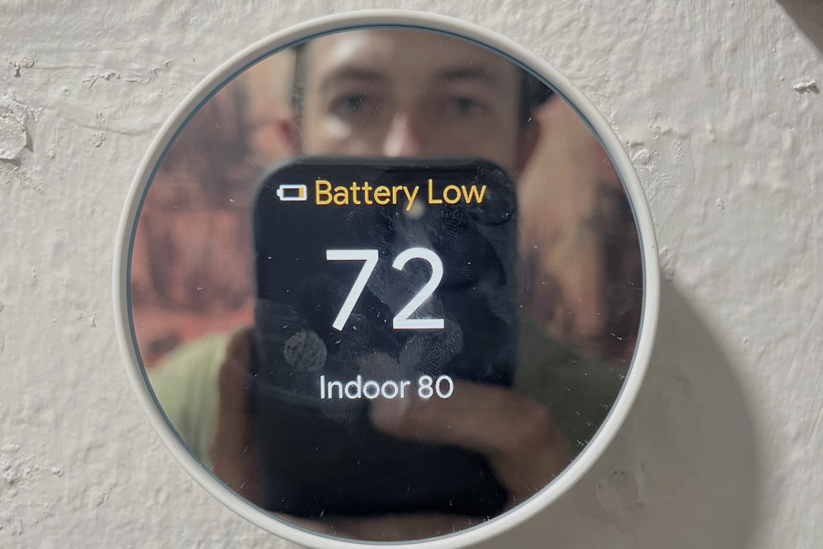 Google Nest smart thermostat mounted on a wall at a customer home