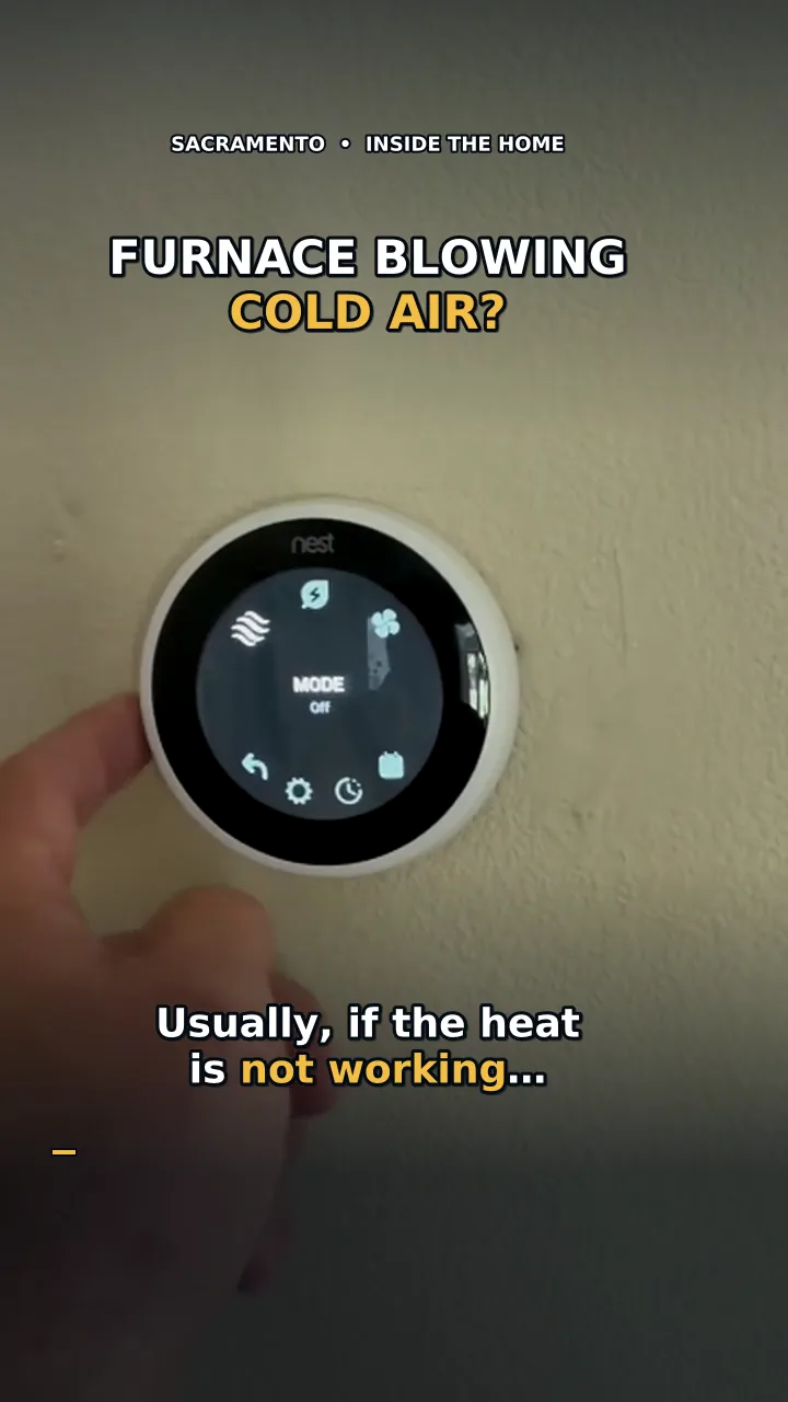 Video still: a hand reaching for a wall thermostat that reads OFF, under the on-screen question Furnace blowing cold air?