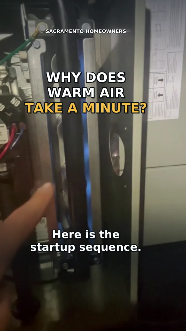 Video still: the open cabinet of a gas furnace on a Sacramento service call, captioned why does warm air take a minute