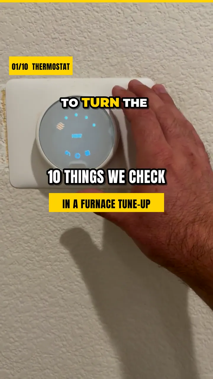 Video still: a hand at a wall thermostat under the on-screen title 10 things we check in a furnace tune-up