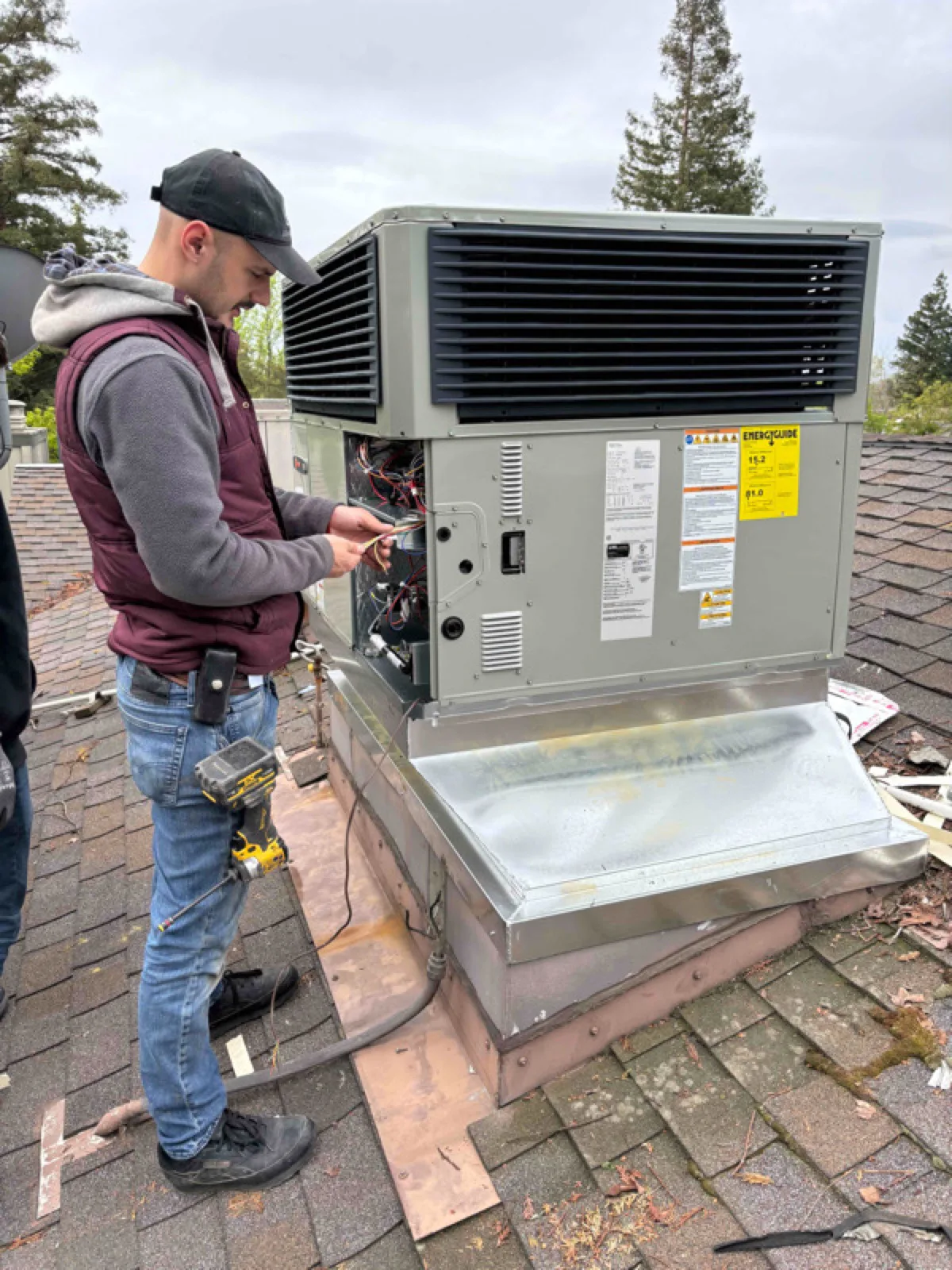 Alpha Mechanical technician on a Sacramento rooftop service call